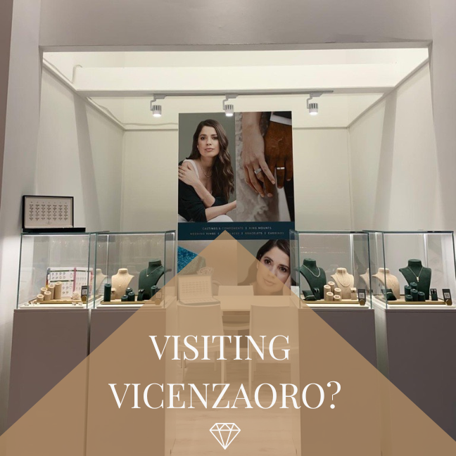 A stand at a show displaying jewellery with "visit Vicenzaoro?" written across the front